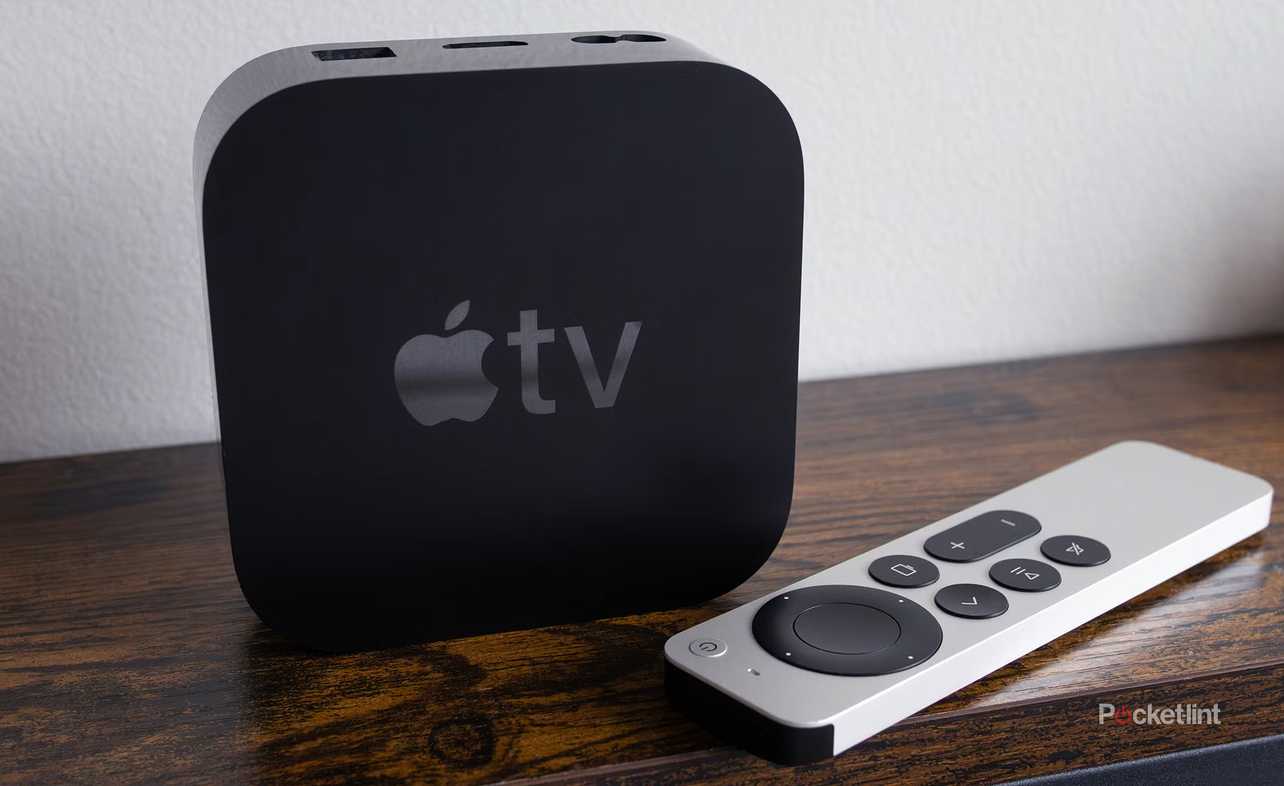 Apple TV 4K and remote on table.