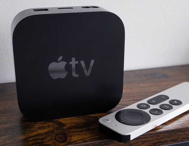 Apple TV 4K and remote on table.