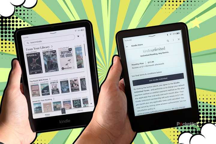 Two Kindles in hand. 