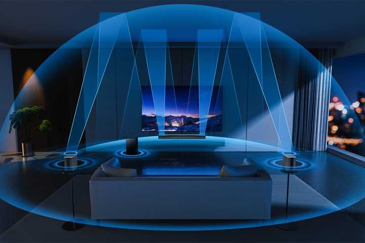 The TCL Q85H soundbar in a living room with illustrated sound cones.