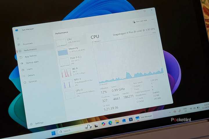 A Windows 11 PC with Task Manager running in a window.